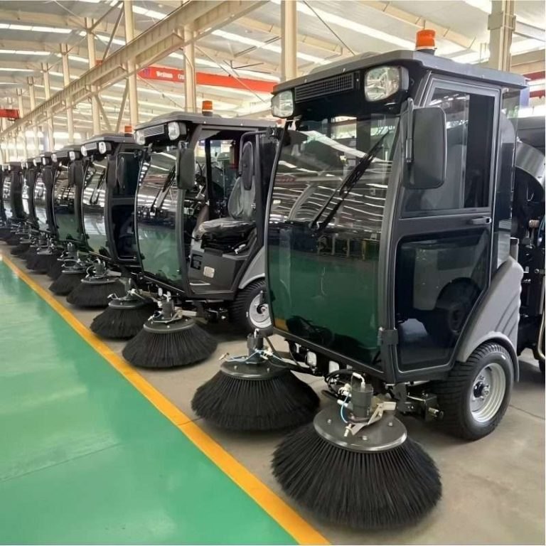 compact street sweeper cleaning a narrow urban road