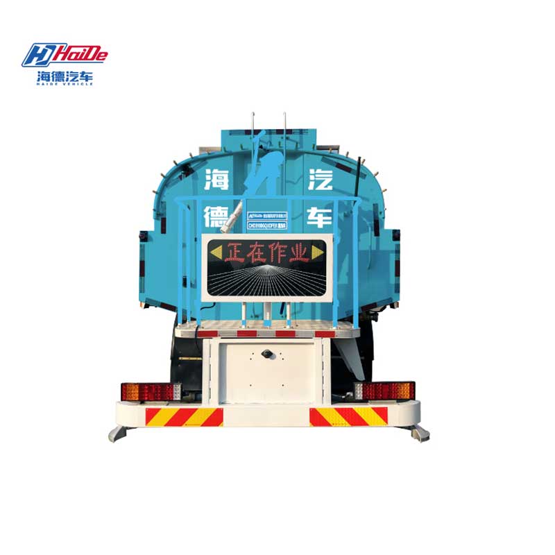 Wide water spray pattern from a road cleaning truck for dust control